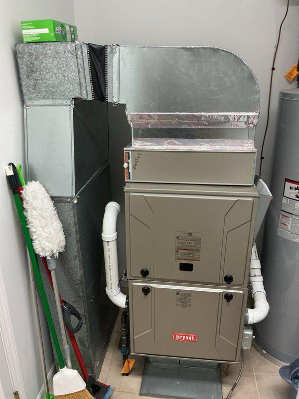 Conducted comprehensive site evaluation for standby generator and air conditioner installation estimate. Assessed existing outdoor HVAC unit condition, noting weathered components and environmental exposure in exterior placement area with adequate clearance for equipment access. Documented current indoor HVAC system configuration including Bryant furnace with high-efficiency PVC venting and metallic ductwork installation in utility space. Evaluated electrical service requirements, equipment placement options, and compatibility with existing mechanical systems. Photographed equipment locations and surrounding areas to develop accurate proposal for whole-house standby generator system and new air conditioning unit replacement.