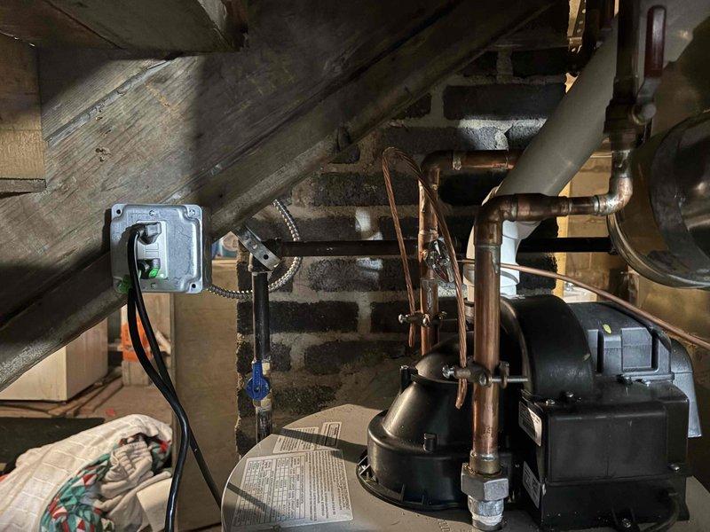 Completed comprehensive inspection corrections for HVAC and water heater installation to meet code compliance. Installed sediment trap for Bradford White water heater and replaced improper gas shutoff valves with code-compliant ball valves for both furnace and water heater. Added proper support hangers for gas line at furnace per manufacturer specifications and Table G2424.1 requirements. Relocated humidistat from supply air plenum to approved location. Installed additional support brackets for furnace and water heater vent piping to ensure proper spacing and stability. Added proper support hangers for refrigerant lineset throughout run. Relocated temperature sensor from 6-inch supply air run to proper position within main plenum for accurate system operation. All corrections verified to meet current mechanical and gas codes, ensuring safe and compliant operation of heating and domestic hot water systems.