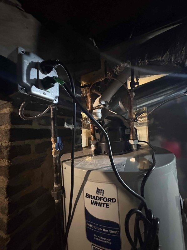 Completed comprehensive inspection corrections for HVAC and water heater installation to meet code compliance. Installed sediment trap for Bradford White water heater and replaced improper gas shutoff valves with code-compliant ball valves for both furnace and water heater. Added proper support hangers for gas line at furnace per manufacturer specifications and Table G2424.1 requirements. Relocated humidistat from supply air plenum to approved location. Installed additional support brackets for furnace and water heater vent piping to ensure proper spacing and stability. Added proper support hangers for refrigerant lineset throughout run. Relocated temperature sensor from 6-inch supply air run to proper position within main plenum for accurate system operation. All corrections verified to meet current mechanical and gas codes, ensuring safe and compliant operation of heating and domestic hot water systems.