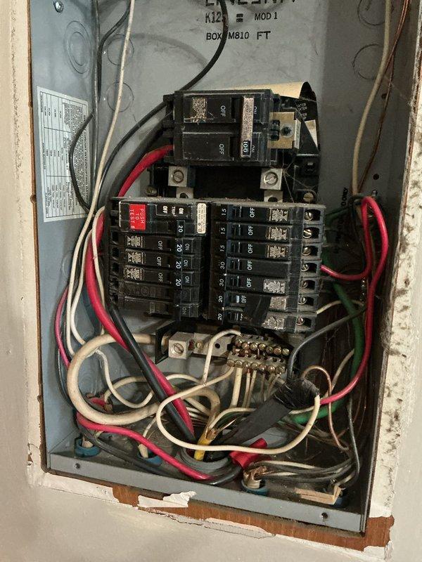 Conducted on-site assessment for furnace and air conditioning system replacement at mobile home property. Evaluated existing electrical service panel and outdoor utility connections to determine compatibility and capacity requirements for new HVAC equipment installation. Documented current electrical infrastructure including main service disconnect, circuit breaker configuration, and exterior meter location to ensure proper sizing and compliance for proposed heating and cooling system upgrade.