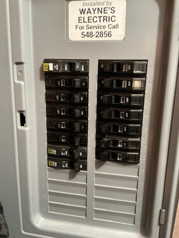 Conducted sales estimate for 40-year-old furnace located in crawlspace that is currently operational but nearing end of service life. Documented existing HVAC system configuration including Emerson programmable thermostat and electrical panel with Wayne's Electric installation, photographed equipment conditions to provide comprehensive replacement options and recommendations for aging heating system.