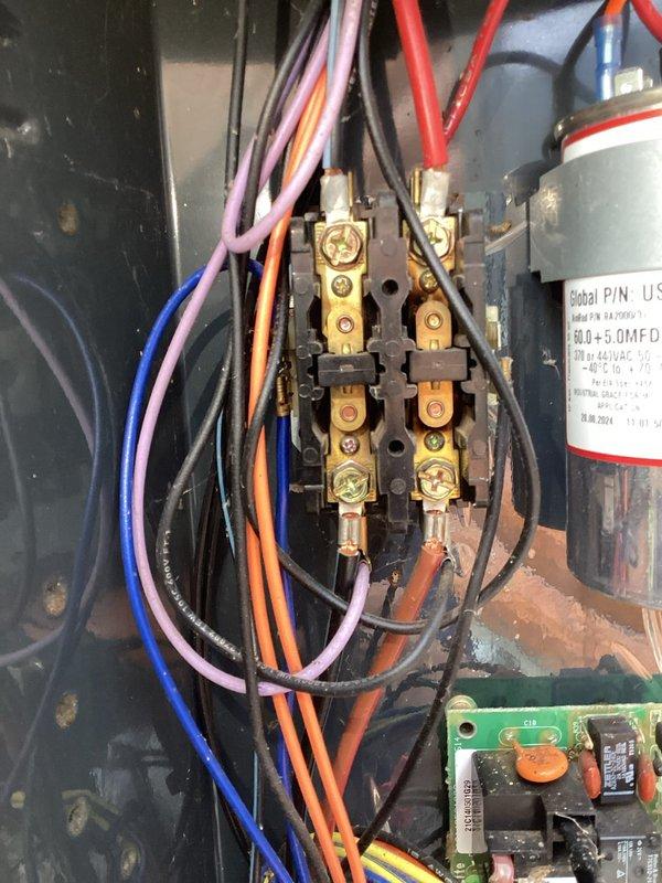 # HVAC Noise Diagnostic

Responded to report of high-pitched whistling noise from AC unit. Performed diagnostic inspection of the system, accessing the electrical control panel and internal components. Documented capacitor specifications (50.0+5.0 MFD) and examined terminal blocks, contactors, and control board for potential noise sources. Inspected interior mechanical components and refrigerant line configuration. Captured photographic documentation of electrical panel wiring, capacitor condition, and internal component layout for service records.