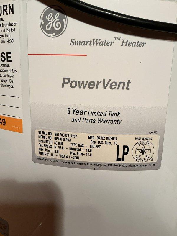 Conducted sales estimate for furnace replacement in residential property. Documented existing HVAC system components including GE SmartWater PowerVent water heater (Model GPM10T67LH1, manufactured 06/2007) with 40,000 BTU input capacity rated for liquid petroleum fuel, along with associated ductwork, copper plumbing lines, and mechanical room infrastructure showing age-related wear and accumulated debris. Photographed equipment specifications and utility space conditions to provide comprehensive assessment for heating system upgrade proposal.