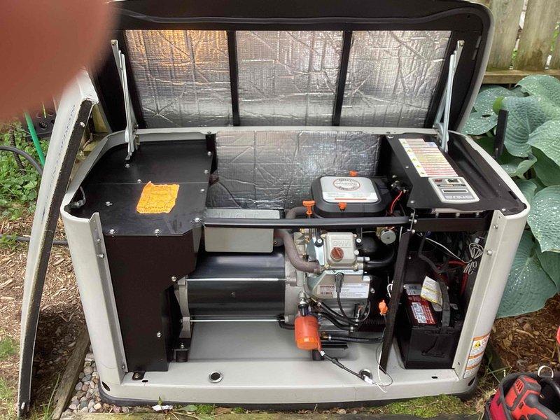Completed annual preventive maintenance on outdoor standby generator unit as requested. Performed comprehensive tune-up service including visual inspection of all accessible components, verification of proper operation, and documentation of equipment condition. Opened access panels to inspect internal mechanical and electrical systems including engine assembly, battery connections, fuel system components, and control modules. Verified all wiring connections were secure with no signs of corrosion or damage. Confirmed insulation material on enclosure lid remains intact and effective. Generator housing and exterior components found to be clean and well-maintained with no visible deterioration. Unit operational and ready for service.