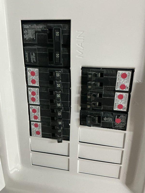 Conducted on-site assessment for mini split system installation in park model RV. Evaluated interior sleeping area layout, existing electrical panel capacity, and determined optimal placement for indoor air handler unit. Photographed electrical service panel showing available circuit breaker capacity and documented interior space configuration to develop comprehensive replacement estimate for ductless HVAC system.