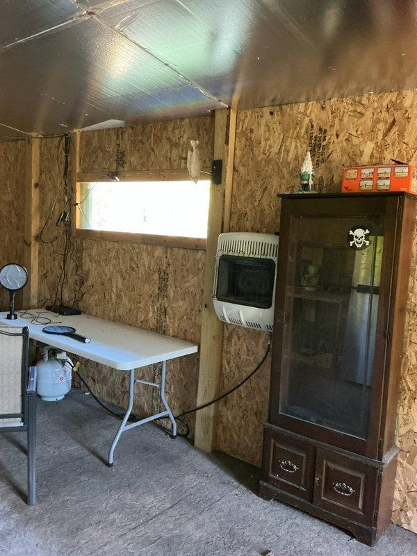 Extended existing water supply line from floor level in unheated pole barn and installed new outdoor spigot with shutoff valve. Applied heat tape to exposed piping to prevent freezing during cold weather months.