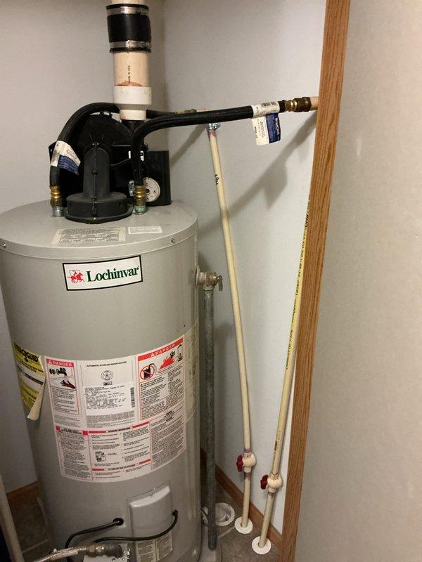 Performed estimate for installing a hot water booster system to provide adequate hot water supply for a Jacuzzi tub. Inspected existing 20-year-old Lochinvar water heater, which is currently functioning without issues, and documented installation conditions including plumbing connections, pressure relief valve assembly, and utility room configuration to determine booster system requirements and compatibility.