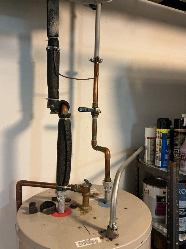 Provided project estimate for tankless water heater replacement to address inadequate hot water supply from existing A.O. Smith ProMax tank-style unit that depletes after less than ten minutes of use. Assessed current water heater installation in utility room, documented existing plumbing configuration including copper supply lines, PVC venting, shutoff valves, and pipe insulation. Evaluated site conditions and access requirements for potential tankless installation to meet expedited timeline requirements.