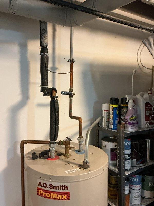 Provided project estimate for tankless water heater replacement to address inadequate hot water supply from existing A.O. Smith ProMax tank-style unit that depletes after less than ten minutes of use. Assessed current water heater installation in utility room, documented existing plumbing configuration including copper supply lines, PVC venting, shutoff valves, and pipe insulation. Evaluated site conditions and access requirements for potential tankless installation to meet expedited timeline requirements.