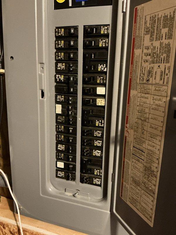 Conducted on-site assessment for new mini-split system installation. Evaluated existing electrical infrastructure, including 200-amp main service panel with dual-column breaker configuration. Documented current electrical capacity and panel conditions to determine compatibility and requirements for mini-split system integration. Captured detailed photographs of electrical panel layout, circuit breaker arrangement, and available capacity for future equipment connection.