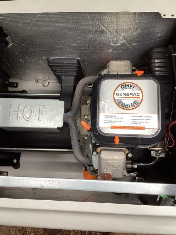 Completed preventive maintenance tune-up on Generac OHVI engine generator unit. Performed comprehensive inspection of engine compartment, air filter assembly, cooling system components, and all mechanical connections. Documented equipment condition through photographic records showing engine housing, insulation integrity, and internal component layout for maintenance history files.
