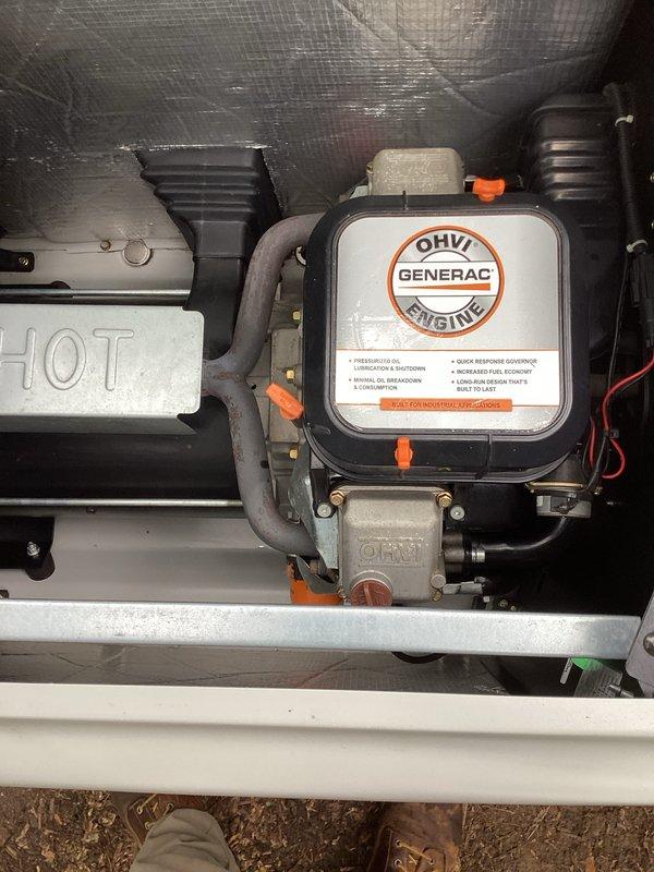 Completed preventive maintenance tune-up on Generac OHVI engine generator unit. Performed comprehensive inspection of engine compartment, air filter assembly, cooling system components, and all mechanical connections. Documented equipment condition through photographic records showing engine housing, insulation integrity, and internal component layout for maintenance history files.