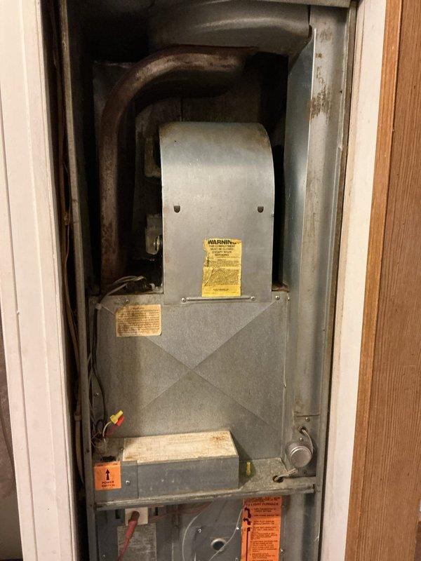 Conducted sales estimate for furnace replacement on existing residential HVAC system. Inspected aging furnace unit with severely corroded heat exchanger component showing significant rust deterioration, indicating potential safety concerns and end-of-life equipment failure. Provided quote for new Miller furnace installation to replace failing system and existing Coleman thermostat.