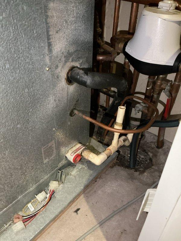 Conducted comprehensive estimate for complete furnace and air conditioning system replacement. Evaluated existing HVAC installation including current air handler unit, ductwork configuration with TRION Air Bear filtration system, and mechanical room layout. Assessed vertical main supply trunk, flexible duct connections, and overall system accessibility for replacement equipment. Documented existing plumbing infrastructure, water heater proximity, and utility room constraints to determine optimal equipment placement and installation requirements. Photographed current equipment specifications, duct configuration, and mechanical space conditions to provide accurate proposal for new high-efficiency heating and cooling system installation.