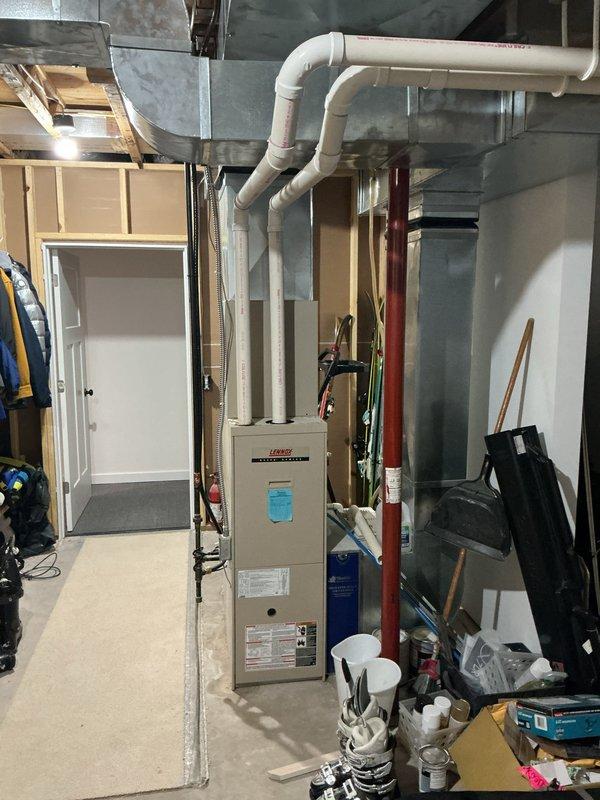 Conducted sales estimate for complete furnace and air conditioning system replacement. Evaluated existing Lennox furnace installation in basement utility area, documenting current equipment condition, ductwork configuration, and venting system setup. Assessed White-Rodgers control board and electrical connections, photographed existing HVAC infrastructure including PVC venting, metal ductwork transitions, flexible duct runs, and copper piping. Reviewed mechanical room layout and clearances to determine optimal equipment placement for new system installation. Provided comprehensive equipment replacement options and installation recommendations based on current system configuration and customer requirements.