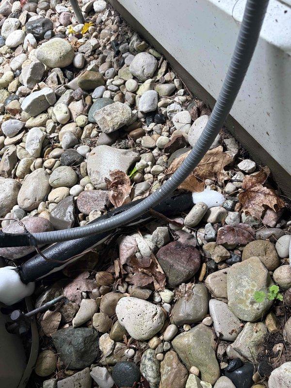 Responded to cooling complaint on 32-year-old Goodman system with condenser unit running but insufficient cooling performance. Upon inspection, identified condensate drainage issue affecting system operation. Cleared blocked condensate line and verified proper drainage flow from evaporator coil. System tested and confirmed operational with adequate cooling restored to home.