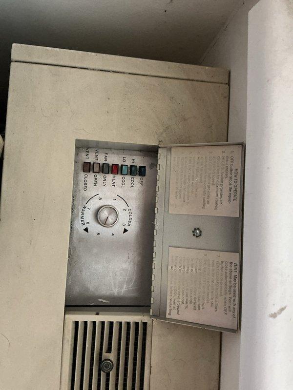 Provided estimate for replacement of 30+ year old Comfortaire wall-mounted HVAC system in condo unit, consisting of indoor wall unit (23.75" W x 17.25" H x 14" D) with corresponding outdoor condenser unit located on deck. Inspected existing system including wall-mounted control panel with mechanical dial controls and portable supplemental air conditioning unit, documented equipment dimensions and configuration, and assessed installation requirements for replacement system.