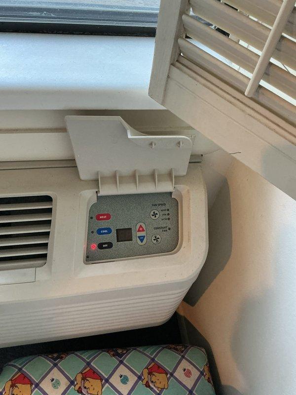 Provided estimate for replacement of 30+ year old Comfortaire wall-mounted HVAC system in condo unit, consisting of indoor wall unit (23.75" W x 17.25" H x 14" D) with corresponding outdoor condenser unit located on deck. Inspected existing system including wall-mounted control panel with mechanical dial controls and portable supplemental air conditioning unit, documented equipment dimensions and configuration, and assessed installation requirements for replacement system.