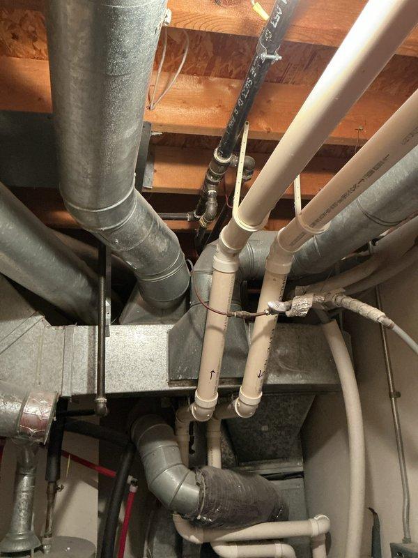 Conducted on-site evaluation for central air conditioning installation estimate for a 1700 square foot residential property. Assessed existing home infrastructure including exterior utility connections, electrical service panel location, and basement mechanical space with current ductwork and plumbing configuration to determine optimal placement and installation requirements for new HVAC system.