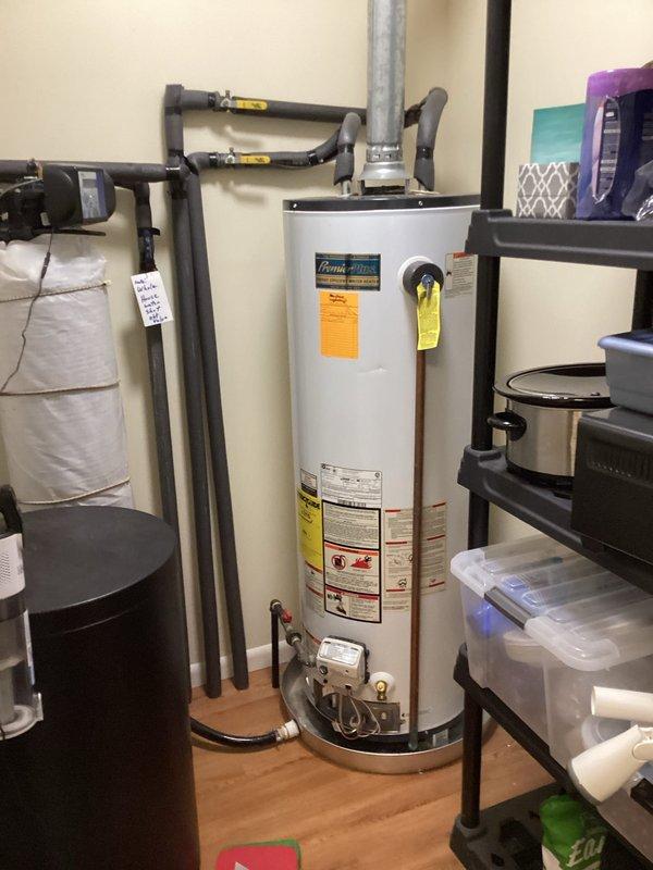 Responded to no hot water complaint on 13-year-old American water heater. Upon inspection, determined unit had excessive sediment buildup and calcification in tank, compromising heating efficiency and hot water delivery. Provided estimate for water heater replacement due to age and condition of existing unit.