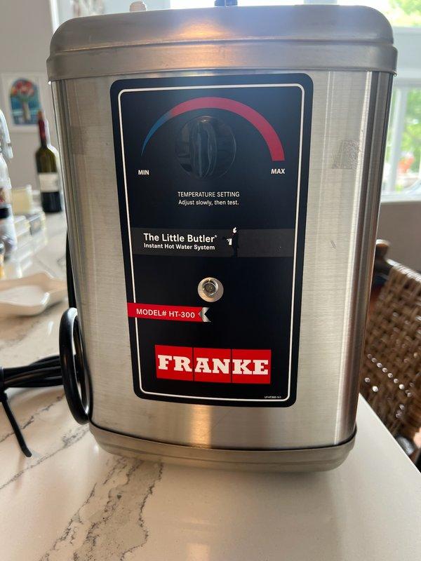 Removed previously installed instant hot water system and replaced with Franke Little Butler HT-300 Instant Hot Water System per original customer specification. Unit was ordered from Fresh Water System, received, and installed on marble countertop with proper electrical connection and water supply lines.