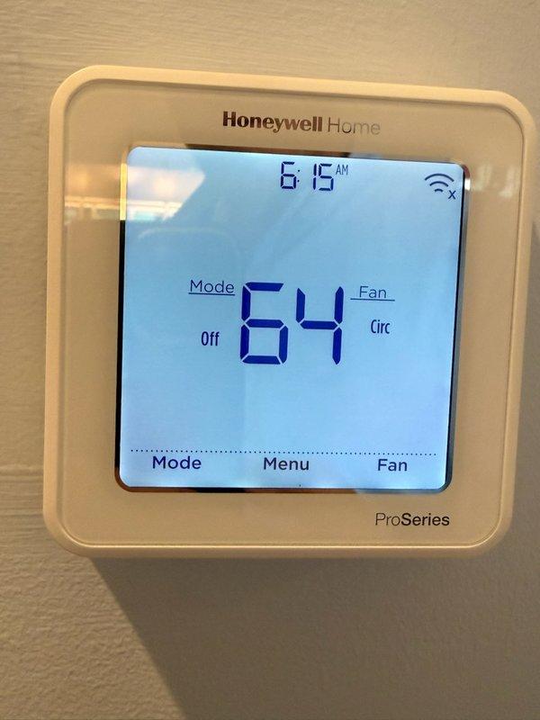 # CP-Cooling Problem Resolution

Responded to a second visit call regarding overcooling issue following previous day's service work. System was cooling excessively and not shutting off properly as programmed. Upon arrival, accessed property via garage code as clients were not home.

Inspected both thermostats present in the system - a Honeywell Home ProSeries programmable thermostat and a White Rodgers programmable thermostat. Honeywell unit displayed 64°F with system in "Off" mode and fan set to "Circ" (circulation) at time of inspection. White Rodgers unit showed current temperature of 64°F with setpoint of 70°F in "HOLD" mode.

Identified thermostat programming and configuration issues causing the continuous cooling cycle. Adjusted thermostat settings to correct the overcooling condition and ensure proper system cycling. Verified temperature differential and cycle timing parameters were properly configured to allow normal system shutdown when target temperature is reached.

Tested s
