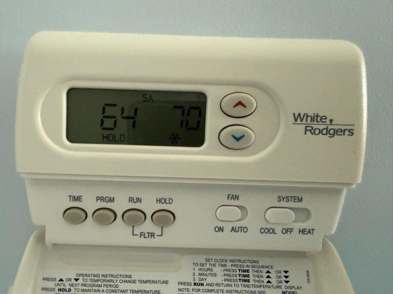 # CP-Cooling Problem Resolution

Responded to a second visit call regarding overcooling issue following previous day's service work. System was cooling excessively and not shutting off properly as programmed. Upon arrival, accessed property via garage code as clients were not home.

Inspected both thermostats present in the system - a Honeywell Home ProSeries programmable thermostat and a White Rodgers programmable thermostat. Honeywell unit displayed 64°F with system in "Off" mode and fan set to "Circ" (circulation) at time of inspection. White Rodgers unit showed current temperature of 64°F with setpoint of 70°F in "HOLD" mode.

Identified thermostat programming and configuration issues causing the continuous cooling cycle. Adjusted thermostat settings to correct the overcooling condition and ensure proper system cycling. Verified temperature differential and cycle timing parameters were properly configured to allow normal system shutdown when target temperature is reached.

Tested s