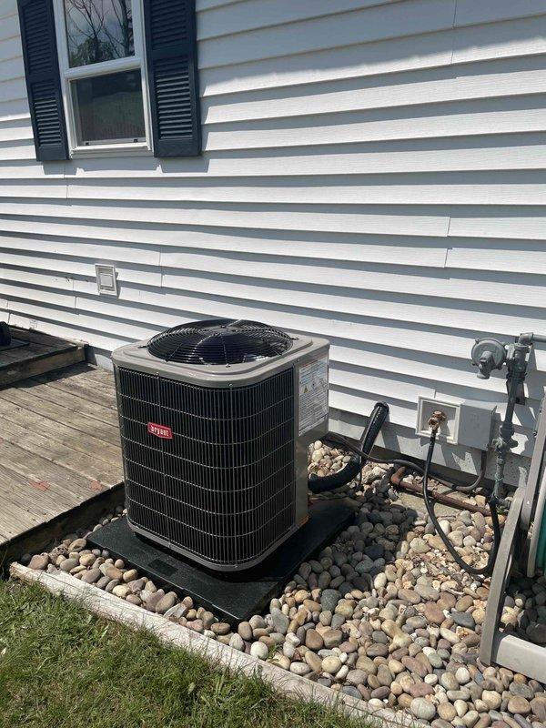 Completed full HVAC system replacement including removal and disposal of existing evaporator coil and air conditioning unit. Installed new single-stage 80% efficiency furnace with reconnected venting and combustion air systems. Installed new Bryant 2-ton air conditioning condenser (model 134SAN02400ABAA) with factory charge of 3.38 lbs R-410A refrigerant and TXV metering device, positioned on rubber isolation pad with rock landscaping base. Installed new evaporator coil after coordinating equipment delivery from supply house, with technician switching to ICP coil specification during installation process. Reconnected refrigerant lines, electrical connections at 208-230V 1PH 60Hz service, and verified proper system operation. All components tested and operational upon completion.