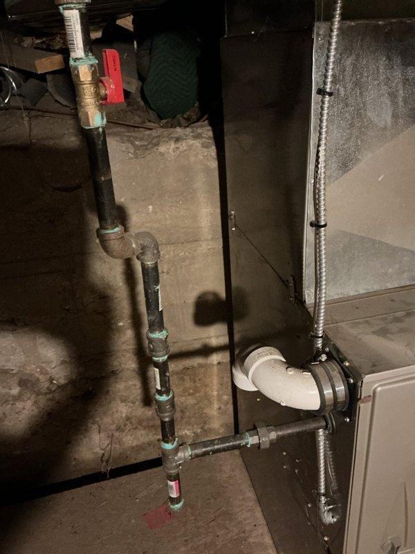 Conducted on-site evaluation for residential air conditioning installation in home currently equipped with heating only. Assessed existing basement HVAC infrastructure including furnace unit, ductwork system, and available space for AC equipment integration. Documented current system configuration showing metal supply ductwork, plumbing infrastructure with pressure gauges, and crawl space accessibility for installation work. Evaluated electrical service capacity, condensate drain routing options via existing PVC piping, and determined optimal placement for indoor air handler and outdoor condensing unit. Provided comprehensive estimate for complete central air conditioning system installation utilizing existing duct infrastructure where applicable.