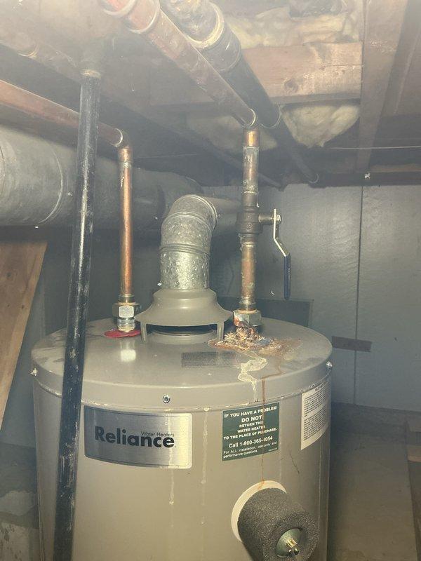Conducted comprehensive site assessment for complete boiler replacement estimate at residential property. Evaluated existing hydronic heating system including aging boiler unit and Reliance water heater with associated copper piping, gas lines, and venting infrastructure in basement utility area. Documented current equipment configuration, photographed mechanical connections, and assessed feasibility of multiple replacement options including modern boiler system installation versus alternative forced-air HVAC conversion, as well as potential integrated water heater replacement to optimize overall system efficiency and performance.