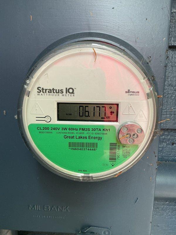 Conducted site assessment for whole home standby generator installation. Evaluated existing electrical service infrastructure, documenting 200-amp main service panel with Stratus IQ digital meter and current electrical capacity. Photographed meter base configuration, service entrance location, and available installation area adjacent to existing HVAC equipment on exterior foundation. Assessed clearance requirements, utility access points, and optimal generator placement on concrete pad near house perimeter. Reviewed electrical load requirements and transfer switch integration options with existing 240V three-wire service. Prepared comprehensive estimate for complete standby generator system installation including equipment specifications, transfer switch, and necessary electrical connections.