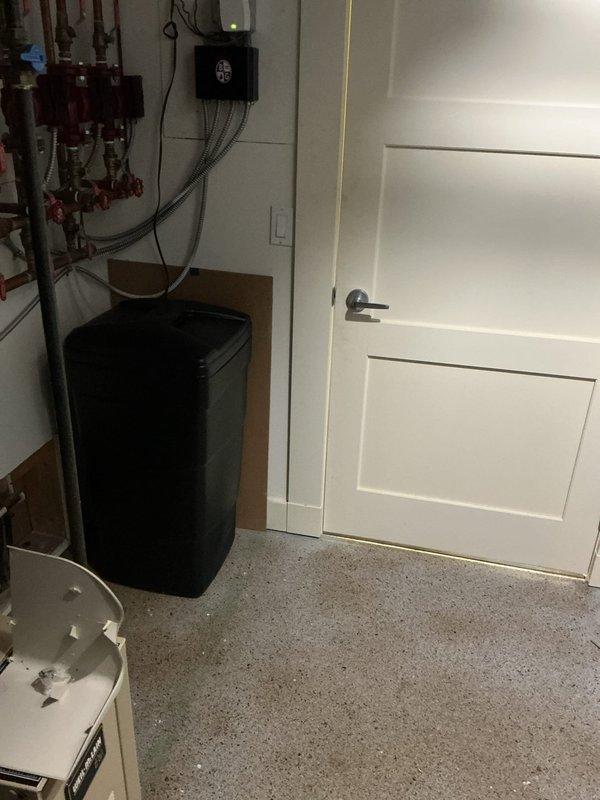 Removed and replaced non-functioning Culligan water softener system with new 2-cubic-foot Sterling water softener and carbon filter combination unit in basement utility room. Replaced deteriorated saddle valve with new valve during installation. Water testing confirmed hardness level of 17 grains per gallon with all other parameters within acceptable range. New carbon filter installed to improve water taste and odor while extending softener media lifespan. Connected all copper supply lines, installed blue Amtrol pressure tank, and verified proper operation of black control valve on softener unit. System tested and confirmed operational upon completion.