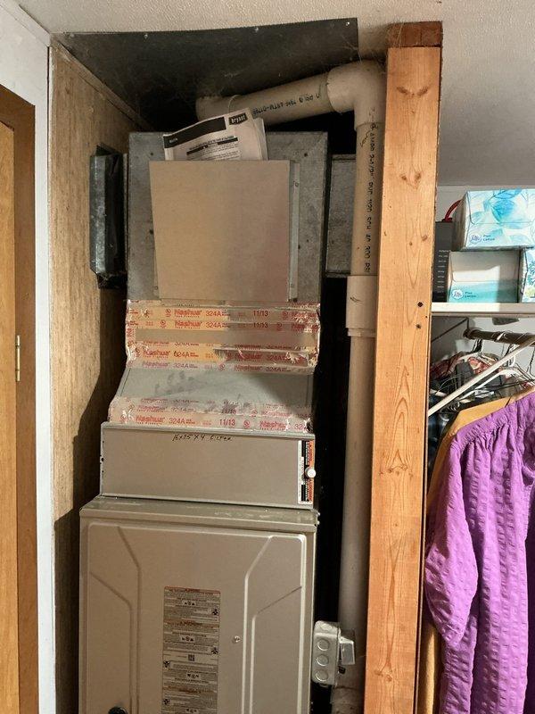 Completed air conditioning system replacement at residential property. Installed new vertical HVAC air handler unit in existing utility closet with proper framing and ductwork connections. Verified electrical service panel compatibility with 200A mains rating and documented emergency circuit configurations for system integration.