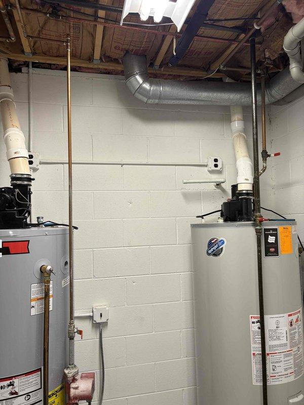 Installed a 75-gallon power vent water heater with domestic expansion tank in basement utility room. Completed all necessary copper piping connections, venting through existing ductwork system, and integrated thermal expansion tank to protect plumbing system from pressure fluctuations. Unit was staged and prepared prior to installation, with all connections tested and verified operational upon completion.
