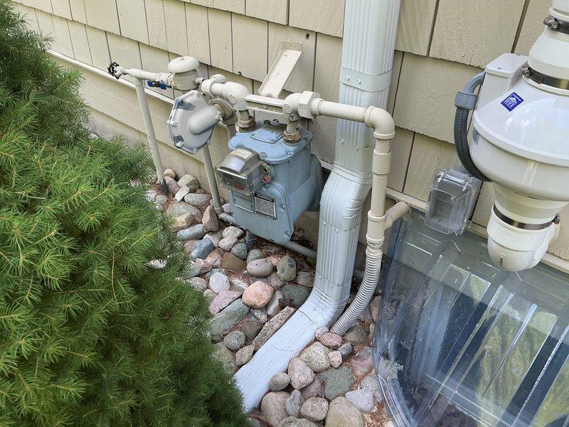 Responded to service call for non-functional Kohler generator system, approximately 23 years old, installed on exterior concrete pad. Upon arrival, coordinated with on-site contact as property owner was unavailable. Conducted visual inspection and documentation of generator unit and associated utility connections, including natural gas meter, supply piping, and electrical components. Generator exhibited signs of age-appropriate wear on housing and mounting surface. Photographed equipment positioning, gas service infrastructure, and surrounding installation area for assessment purposes.