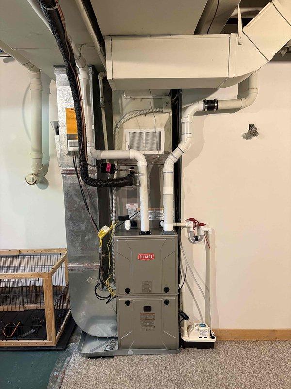 Completed full HVAC system replacement including removal and disposal of existing furnace and air conditioning equipment. Installed new Bryant 2-stage gas furnace with deluxe variable speed blower motor (60%/40% burner staging, fan curve programming) and 16.5 SEER2 outdoor condensing unit on new pad with gravel base. Installed cased evaporator coil with new line set, safety wet and overflow switches, and PVC condensate drain with pump. Ran new PVC intake and exhaust venting through exterior wall. Fabricated and installed sheet metal transitions for proper airflow distribution. Reconnected natural gas line to new furnace burner assembly. Completed all electrical work including new breaker, circuit wiring, disconnect box, and whip connections to both indoor and outdoor units. Reused existing thermostat with system compatibility verification. All work performed to code with required permits obtained and inspections passed. System tested and confirmed operational with proper staging, airfl