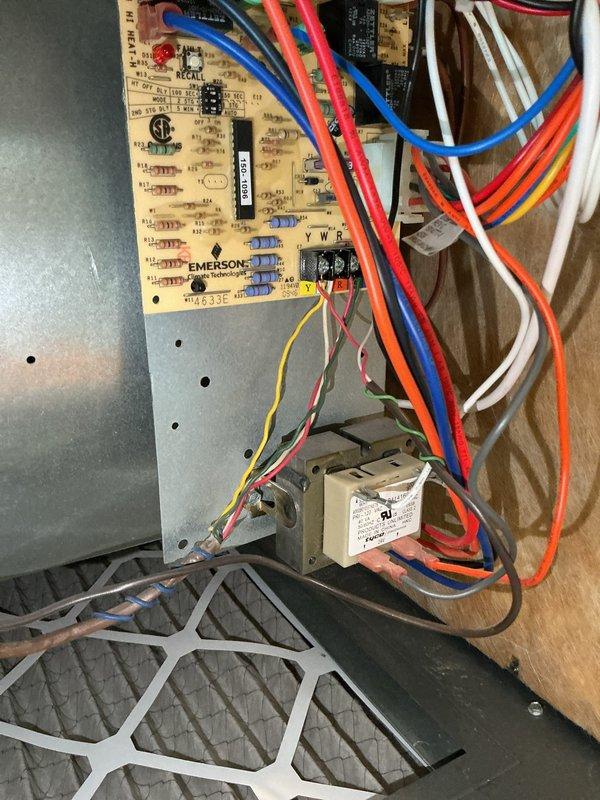 Performed comprehensive furnace system evaluation for home warranty estimate. Documented existing HVAC installation including Emerson control board, gas valve assembly, blower motor components, electrical wiring configurations, PVC venting and condensate drain lines, and filtration system. Captured detailed photographs of internal components with access panel removed to assess overall system condition and operational status for estimate preparation.
