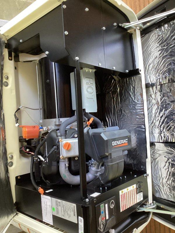 Completed annual maintenance and tune-up on Generac backup generator unit installed in residential enclosure. Performed comprehensive inspection of engine components, verified proper operation of all mechanical systems, checked exhaust piping connections, and documented equipment condition with photos showing clean installation and proper mounting within housing system.