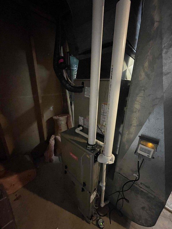 Completed full HVAC system replacement including removal and disposal of existing furnace and air conditioning equipment. Installed new high-efficiency furnace featuring 2-stage gas burner with variable speed blower motor (60%/40% modulation) and new 13.4 SEER2 outdoor condensing unit on concrete pad. Installation included cased evaporator coil, refrigerant line set, and all necessary sheet metal transitions for proper airflow distribution.

Established complete venting system using PVC intake and exhaust piping routed vertically through basement with proper terminations. Installed PVC condensate drain line with safety wet switch and overflow protection to prevent water damage. Reconnected existing natural gas supply line to new furnace with proper sizing and leak testing.

Completed all electrical work including new breaker installation, circuit wiring, outdoor disconnect, and electrical whip to condensing unit. Reused existing thermostat with reconnection to new equipment for system 