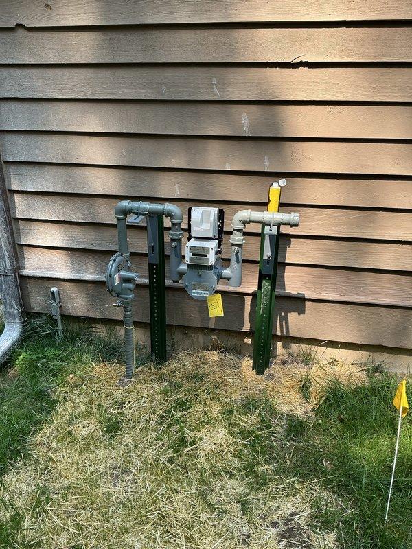 Completed conversion from liquid propane to natural gas system. Installed new gas meter assembly with exterior mounting brackets, connected supply piping with appropriate shut-off valves, and integrated the natural gas line into the existing HVAC and mechanical systems located in the basement utility area. All connections were tested and verified operational in coordination with the electrical utility company.