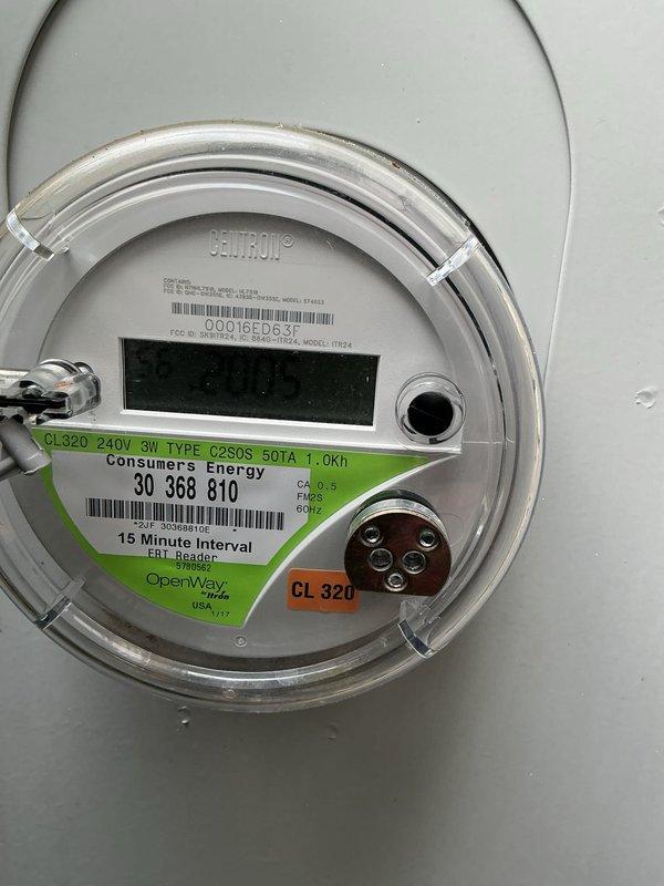 Conducted site assessment for standby generator installation. Documented existing electrical service with Consumers Energy 320-amp, 240-volt, 3-wire meter equipped with 15-minute interval monitoring capability. Evaluated natural gas service infrastructure, confirming availability of fuel source via existing Honeywell meter with adequate capacity rating of 40-250 CFH. Photographed utility connections, service entry configuration, and meter locations to develop comprehensive generator sizing and installation proposal.