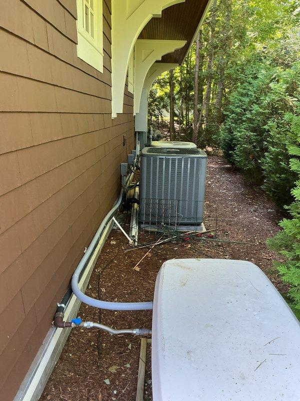 Conducted comprehensive assessment of existing residential air conditioning system including exterior condensing unit and interior furnace/air handler located in attic space. Documented current equipment configuration, refrigerant line routing with exposed insulation sections, condensate drainage system, and ductwork layout. Evaluated system placement, accessibility for service, and overall condition to provide accurate replacement estimate for single AC unit upgrade.