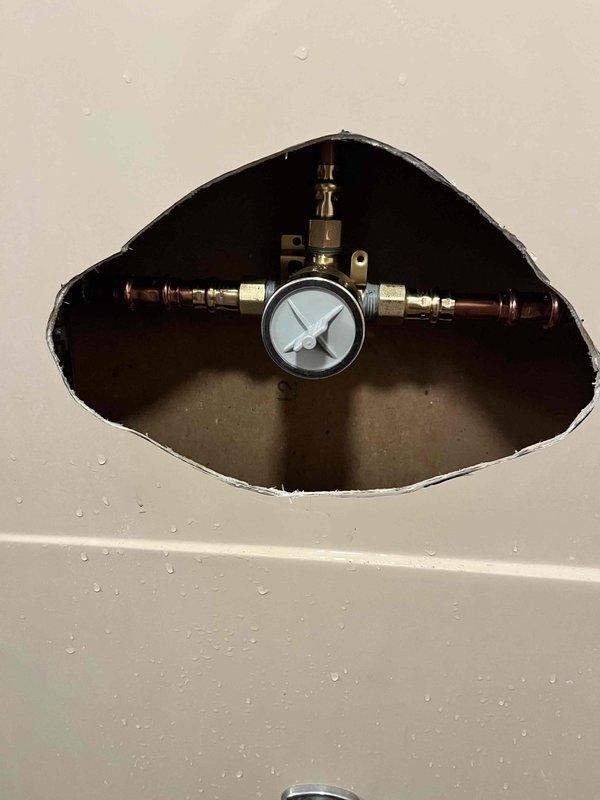 Replaced malfunctioning tub/shower valve assembly as quoted. Accessed plumbing through wall opening, removed old valve, and installed new pressure-balanced mixing valve with chrome trim. Verified proper hot and cold water operation and tested system pressure. Reinstalled escutcheon plate and handle, ensuring smooth temperature control functionality.