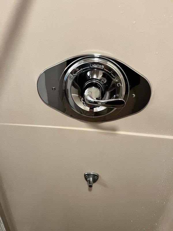 Replaced malfunctioning tub/shower valve assembly as quoted. Accessed plumbing through wall opening, removed old valve, and installed new pressure-balanced mixing valve with chrome trim. Verified proper hot and cold water operation and tested system pressure. Reinstalled escutcheon plate and handle, ensuring smooth temperature control functionality.