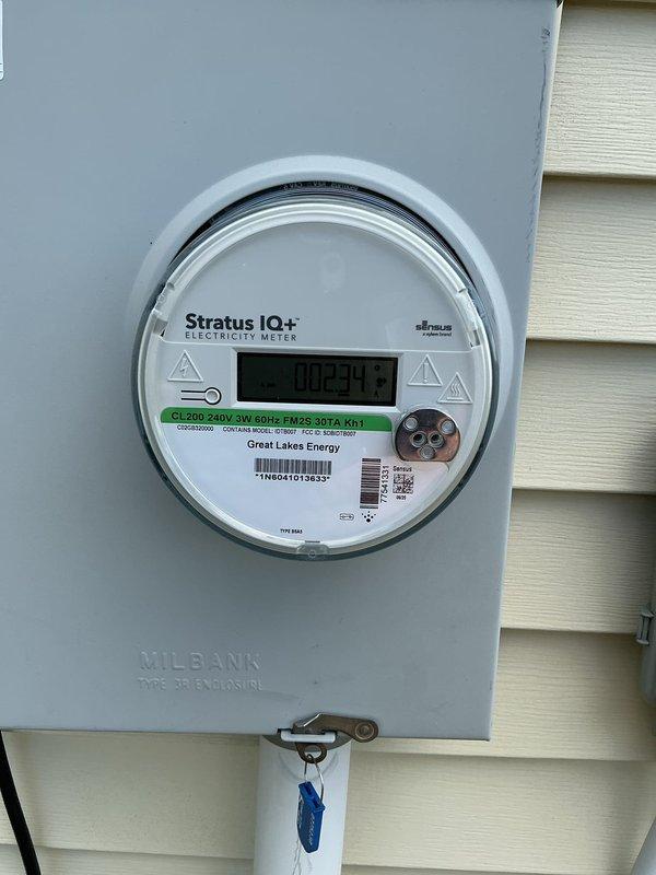 Conducted site evaluation for standby generator installation from Kohler lead. Documented existing electrical service showing Stratus IQ+ digital meter rated at 200A, 240V, 3-wire, 60Hz connected to Great Lakes Energy service in Milbank Type 3R outdoor enclosure. Inspected main electrical panel revealing main breaker and Square D branch circuit breakers with capacity assessment for generator integration requirements.