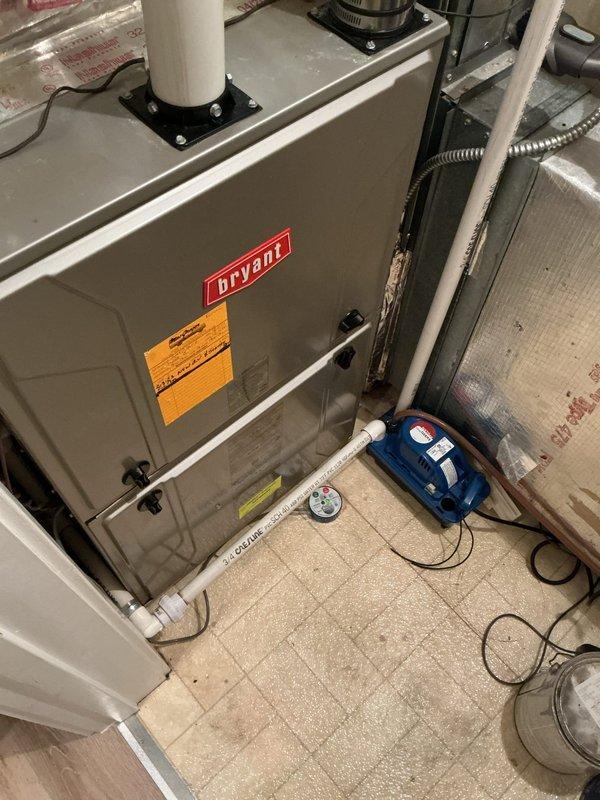 Conducted on-site assessment for AC system replacement estimate. Documented existing HVAC equipment including Bryant furnace and current thermostat configuration. System evaluation revealed need for crane access to complete installation due to property constraints. Captured detailed photos of indoor equipment, thermostat displaying 76° with 57% humidity, and overall system layout for accurate proposal preparation.