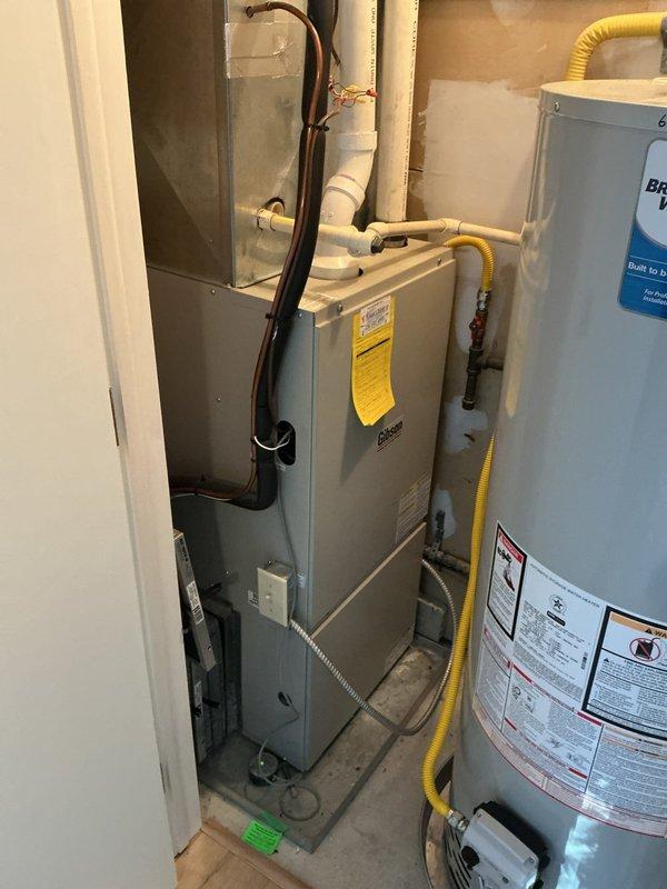 Performed comprehensive tune-up on Bradford White 50-gallon natural gas water heater (Model M2512T01, 40,000 BTU/H input) in response to odor concerns reported by occupant. Completed full system inspection including combustion chamber evaluation, burner assembly cleaning, flue baffle inspection, temperature and pressure relief valve testing, anode rod assessment, and verification of proper venting and gas connections. Discussed potential installation of flow tech anti-scale system as preventative measure for water quality improvement and extended equipment longevity.