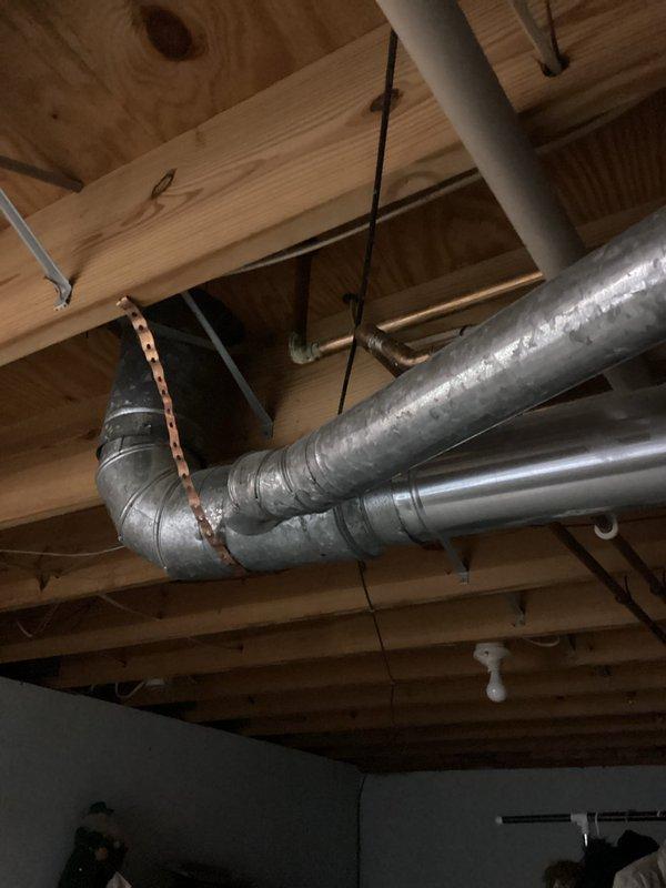 Responded to water leak investigation near boiler and water heater. Performed visual inspection of mechanical room to identify source of moisture concern. Documented existing conditions of water heater installation, associated plumbing connections, and overhead mechanical systems including HVAC ductwork and exposed piping in utility space. Customer awaiting estimate for potential equipment replacement.