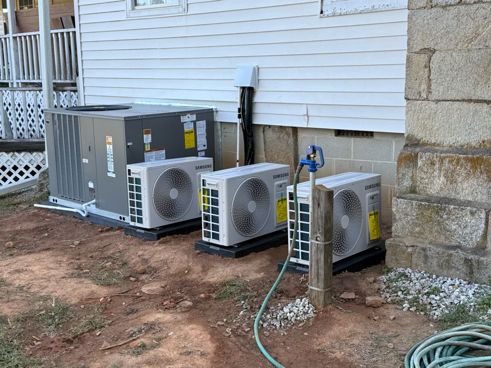 Installation of a new 5 ton Ruud/ream heat pump package unit installation of three 12,000 BTU mini split heads with condensers