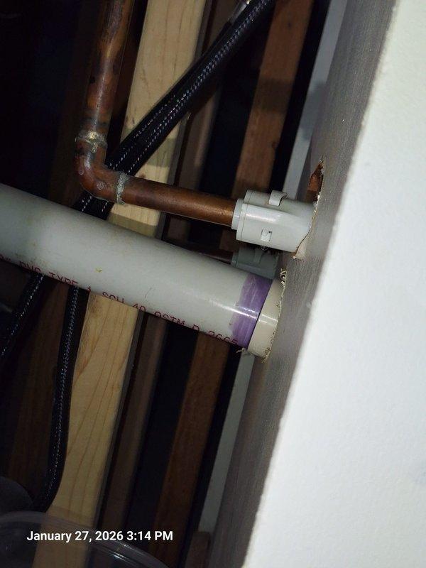 Repaired leaking water connection at customer's basement wet bar. Identified issue at the copper pipe junction with PVC line, which required replacement of deteriorated fitting. Installed new valve and secured all connections to prevent future leakage. Repaired leaking water connection at customer's basement wet bar. Identified issue at the copper pipe junction with PVC line, which required replacement of deteriorated fitting. Installed new valve and secured all connections to prevent future leakage.